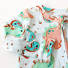 Children's outfit with dinosaur pattern on a white background