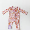 Baby onesie with colorful patterns on a white background